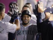 Robinson Cano celebrates his home run with teammates.