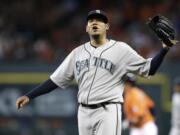 Seattle Mariners starting pitcher Felix Hernandez yells as Houston Astros' Jason Castro, background, rounds the bases on a two-run home run during the first inning Friday, June 12, 2015, in Houston. Hernandez pitched one-third inning giving up five hits and eight runs.