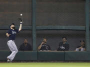 Seattle Mariners left fielder Dustin Ackley makes a catch in front of the bullpen for an out on Houston Astros' Jason Castro in the fourth inning Tuesday in Houston.