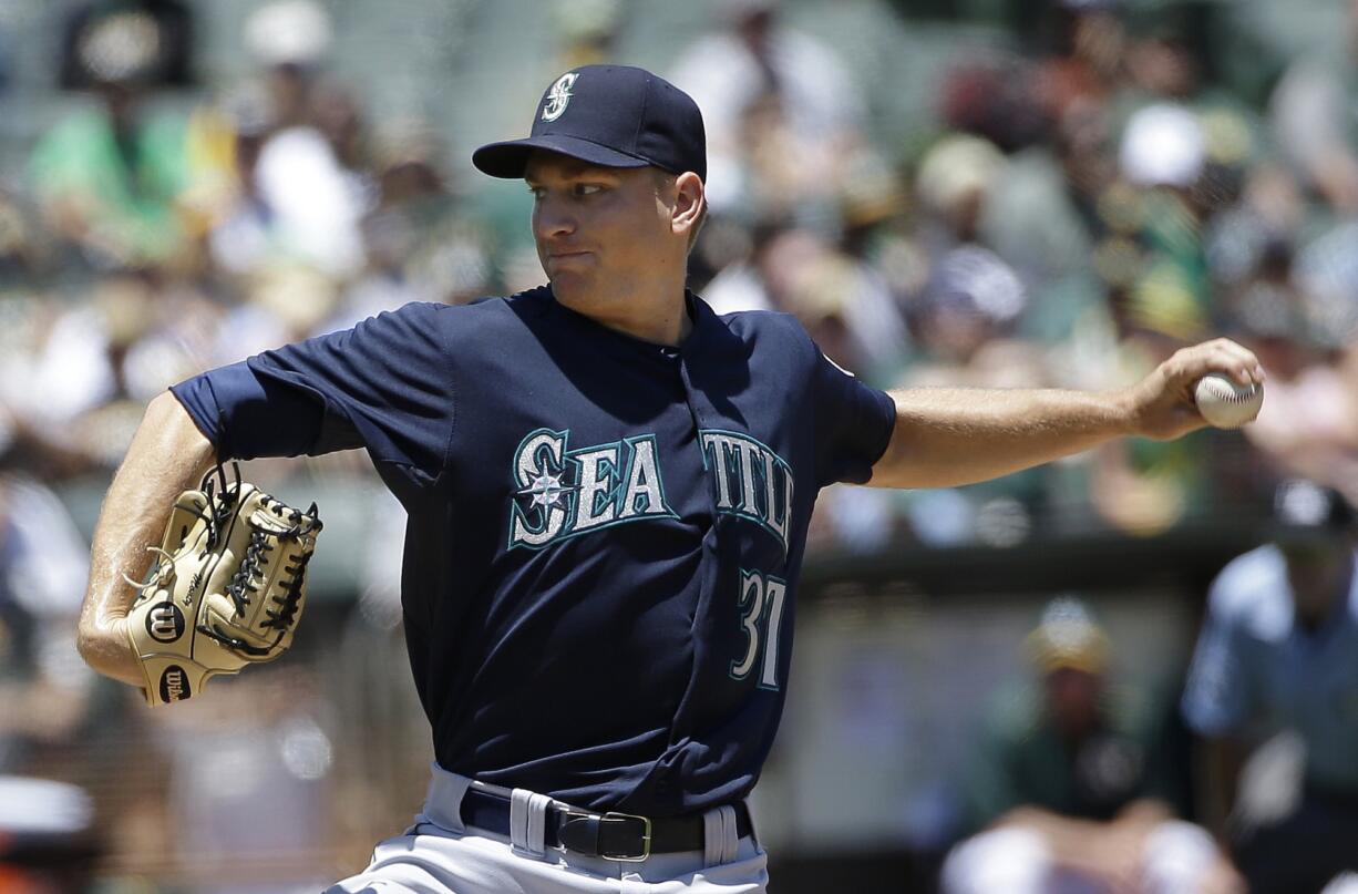 Seattle Mariners pitcher Mike Montgomery throws against the Oakland Athletics during the second inning in Oakland, Calif., Sunday, July 5, 2015.