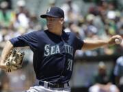 Seattle Mariners pitcher Mike Montgomery throws against the Oakland Athletics during the second inning in Oakland, Calif., Sunday, July 5, 2015.