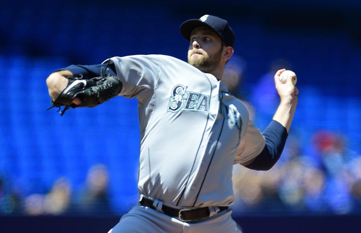 Seattle Mariners starting pitcher James Paxton throws during the first inning against the Toronto Blue Jays, Saturday, May 23, 2015, in Toronto.