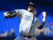 Seattle Mariners starting pitcher James Paxton throws during the first inning against the Toronto Blue Jays, Saturday, May 23, 2015, in Toronto.