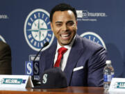 Seattle Mariners' Nelson Cruz smiles as he talks to reporters after being introduced at a baseball news conference, Thursday, Dec.