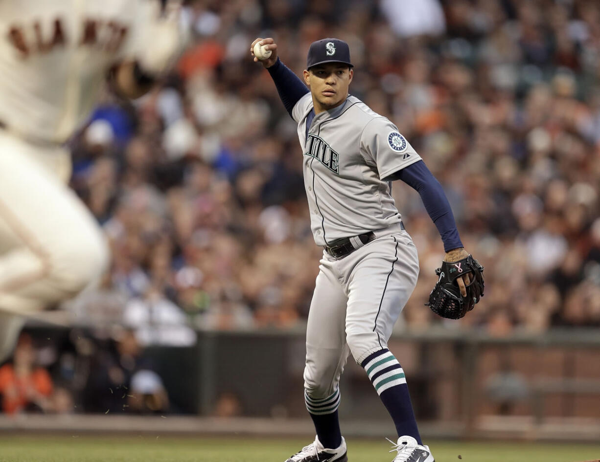 Seattle Mariners pitcher Taijuan Walker throws out San Francisco Giants' Buster Posey in the third inning Monday, June 15, 2015, in San Francisco.