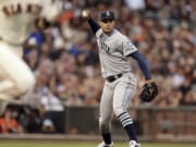 Seattle Mariners pitcher Taijuan Walker throws out San Francisco Giants' Buster Posey in the third inning Monday, June 15, 2015, in San Francisco.