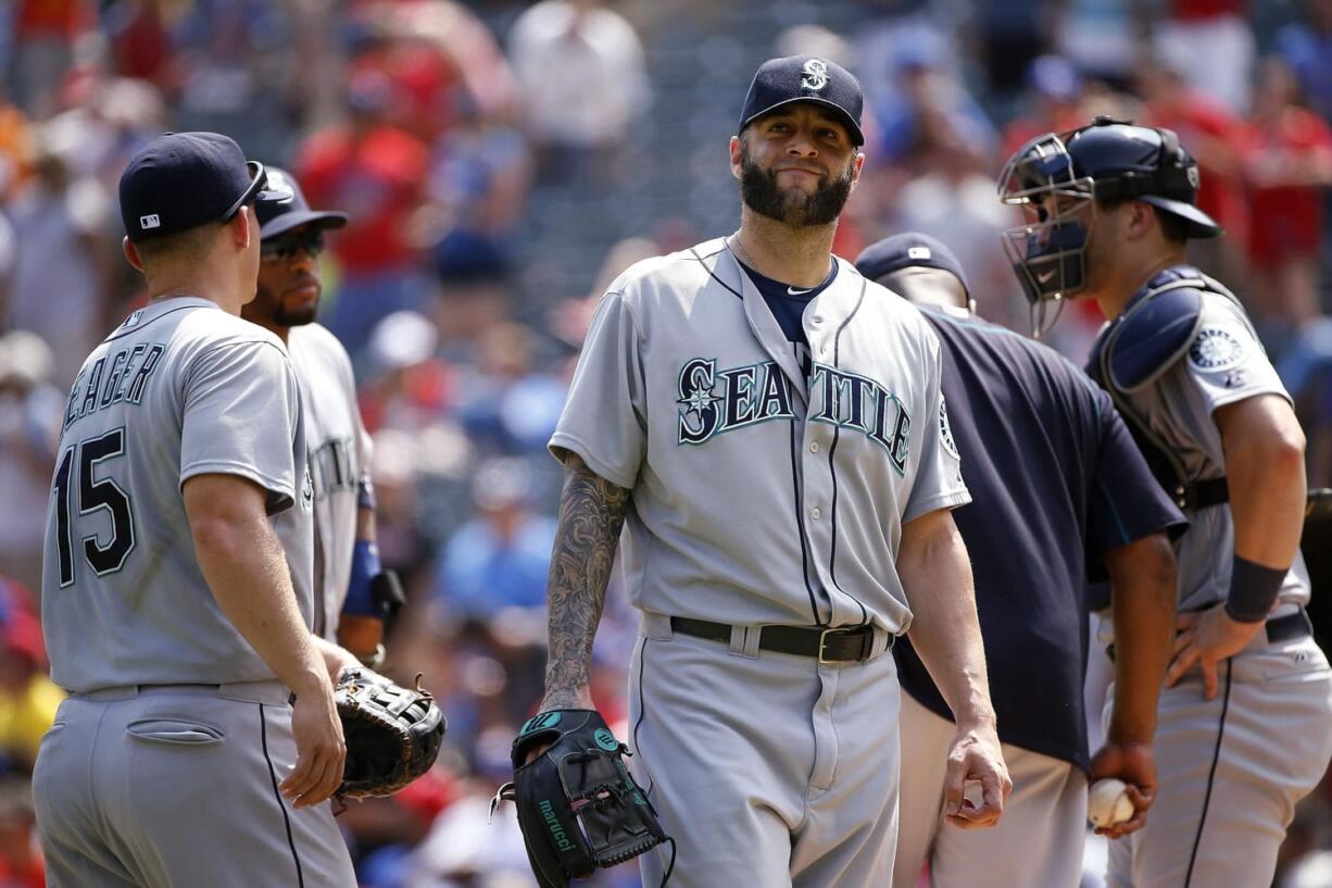 Seattle Mariners relief pitcher Joe Beimel leaves the mound after giving up three straight home runs to the Texas Rangers during the seventh inning of a baseball game Wednesday, Aug. 19, 2015, in Arlington, Texas. The Rangers defeated the Mariners 7-2.