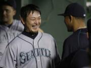 LM Otero/Associated Press
Mariners pitcher Hisashi Iwakuma, of Japan, laughs with teammates after the seventh inning of Seattle's 3-2 win.