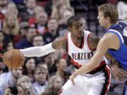 Don Ryan/Associated Press
Portland's LaMarcus Aldridge, left, works the ball in against Dallas' Dirk Nowitzki on Thursday.