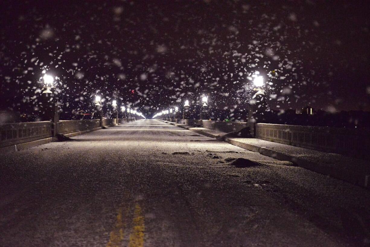 A swarm of mayflies hovers over the Route 462 bridge over the Susquehanna River late Saturday evening, June 13, 2015, between Columbia and Wrightsville, Pa.