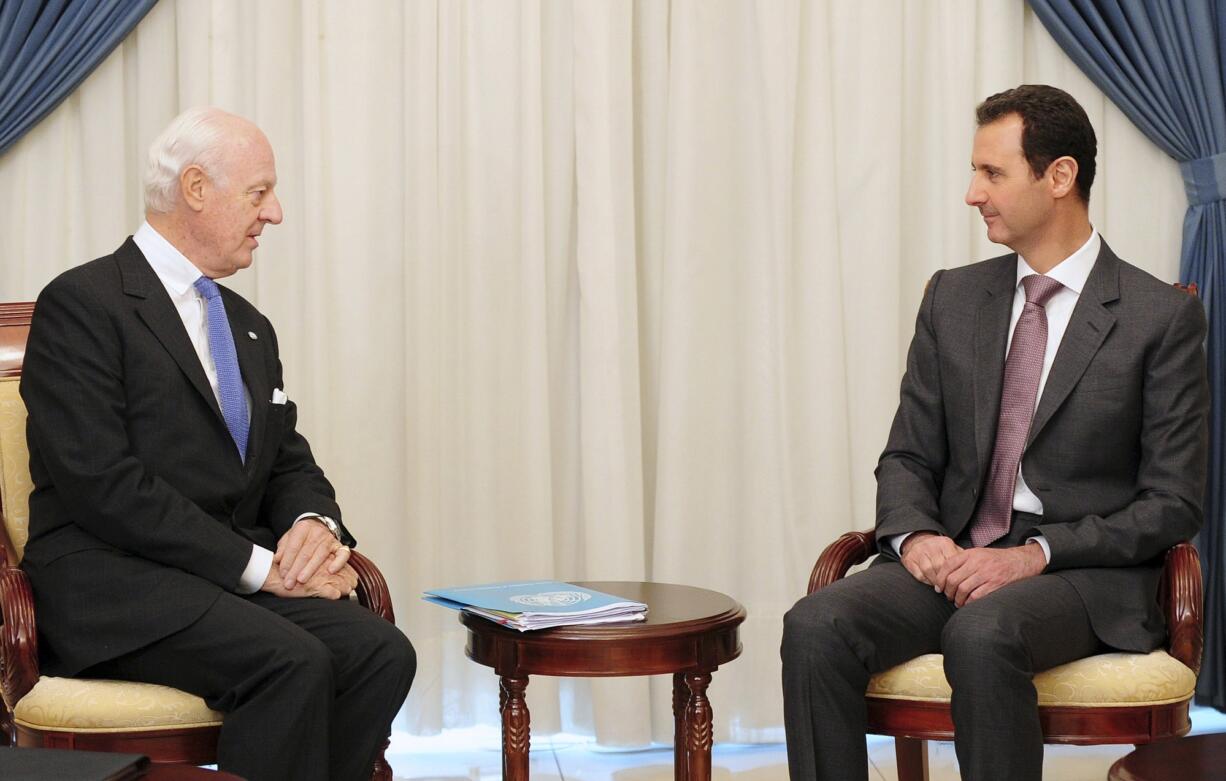 Syrian official news agency SANA
Syrian President Bashar Assad, right, speaks with Staffan de Mistura, the United Nations special envoy to Syria in Damascus, Syria, on Monday.