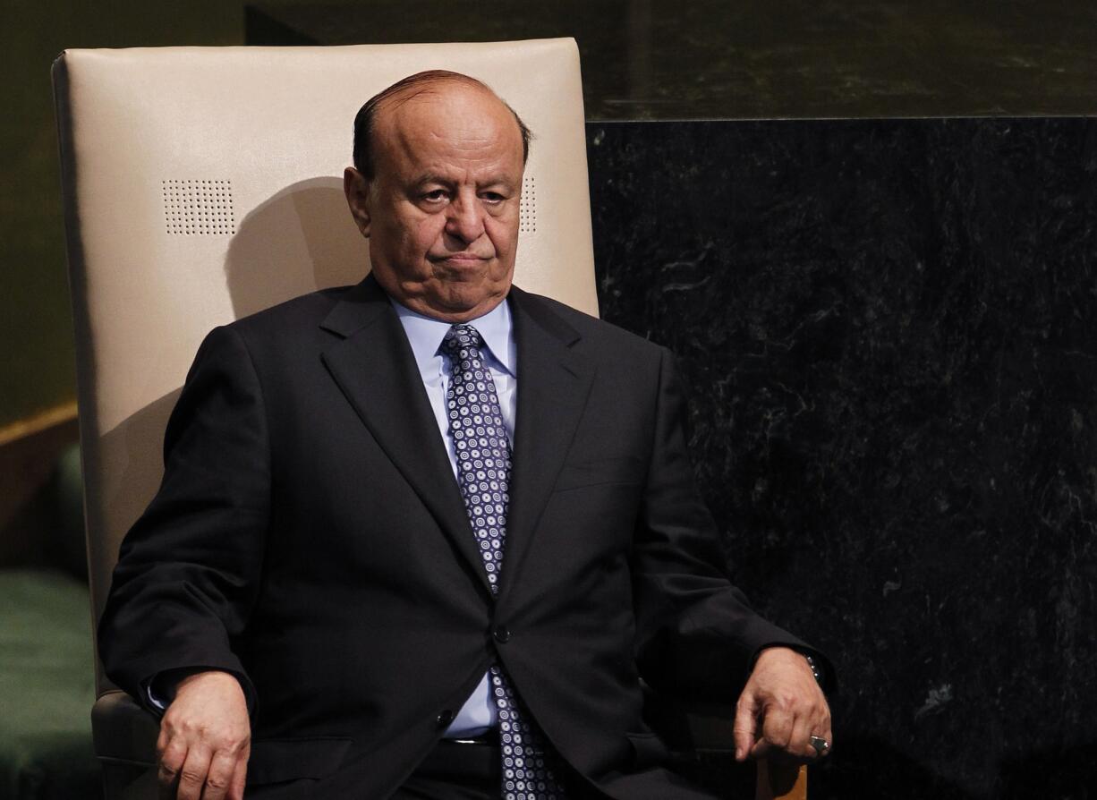 FILE - In this Wednesday, Sept. 26, 2012 file photo, Abed Rabbo Mansour Hadi, President of Yemen, sits after addressing the 67th session of the United Nations General Assembly at U.N. headquarters. Two of the Yemeni embattled president?s advisers said that the president is held ?captive? in hands of Houthis and warned if submitted resignation in protest to Houthis? power grab, to face prosecution.