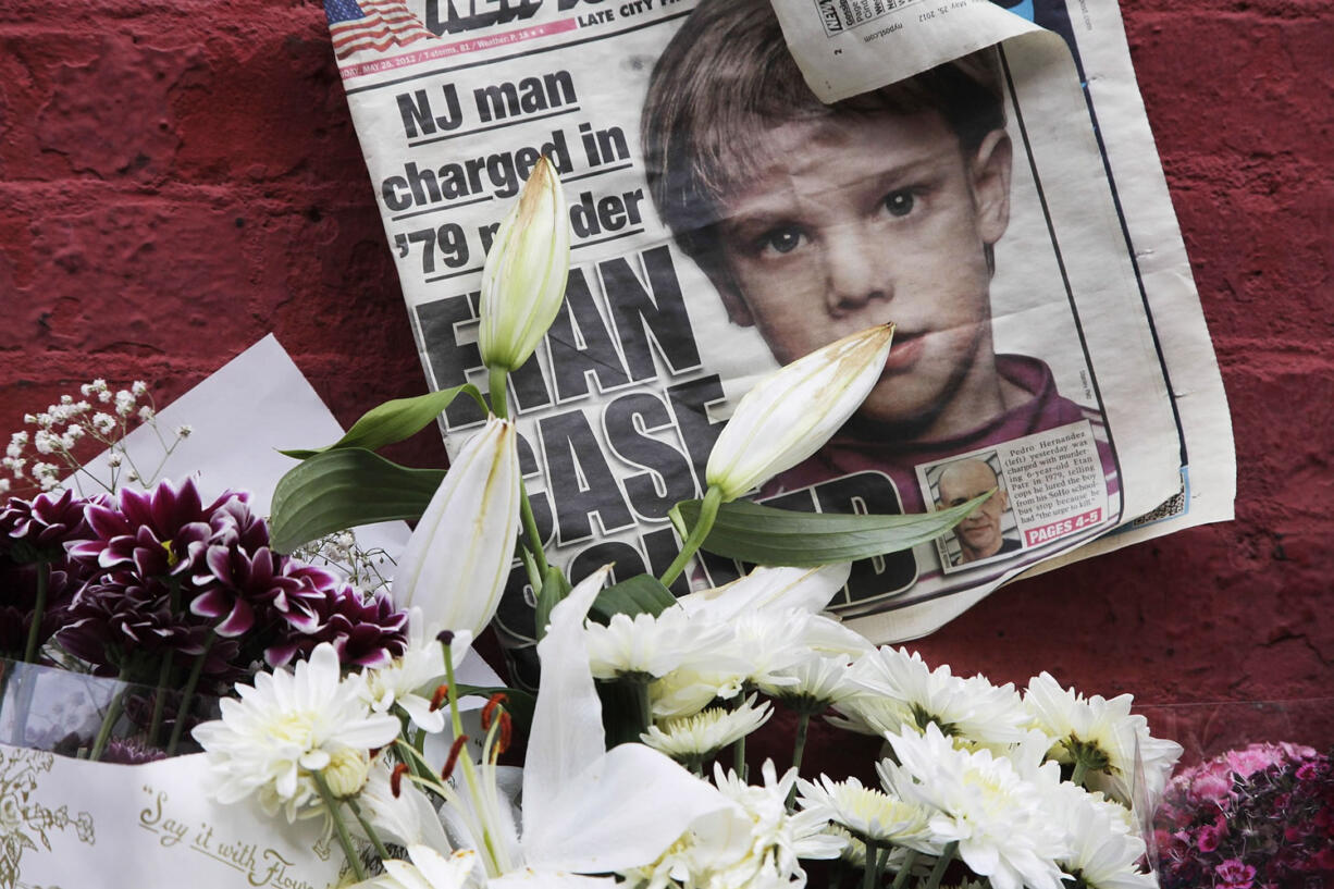 A newspaper with a photograph of Etan Patz sits May 28, 2012, at a makeshift memorial in the SoHo neighborhood of New York where Patz lived before his disappearance on May 25, 1979. The murder trial of Pedro Hernandez, the man accused in the child's disappearance, ended Friday with the jury hopelessly deadlocked after 18 days of deliberations, leaving unresolved a case that has haunted New York City for 36 years.