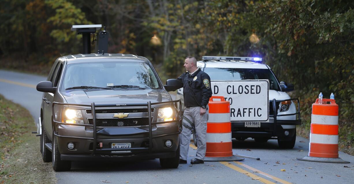 Police block the road leading to the scene of a death investigation in connection with the disappearance of University of Virginia student Hanna Graham in Albermarle County, Va., on Saturday.