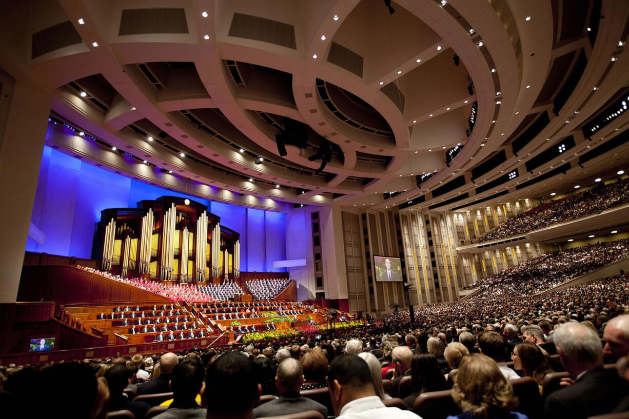 People fill their seats in the Conference Center before the start of opening session of the two-day Mormon church conference Saturday in Salt Lake City.