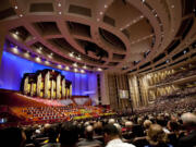 People fill their seats in the Conference Center before the start of opening session of the two-day Mormon church conference Saturday in Salt Lake City.