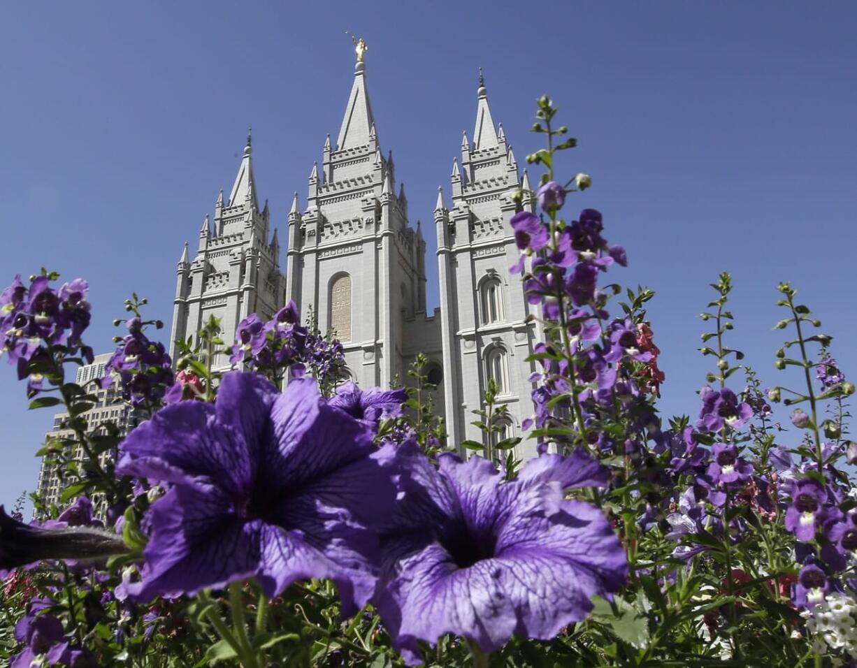 Flowers bloom in front of the Salt Lake Temple in Temple Square in Salt Lake City.