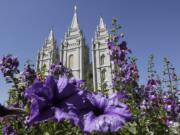 Flowers bloom in front of the Salt Lake Temple in Temple Square in Salt Lake City.