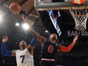 Portland Trail Blazers' Damian Lillard (0), playing for the West team, said he was &quot;surprised&quot; East team's Carmelo Anthony, back, jumped to block his shot on this play during Sunday's All-Star Game at Madison Square Garden.(AP Photo/Bob Donnan, Pool)