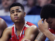 Ohio State guard D'Angelo Russeld looks to the scoreboard late in the second half of an NCAA college basketball tournament round of 32 game against Arizona in Portland, Ore., Saturday, March 21, 2015. Arizona won 73-58.