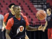 Don Ryan/Associated Press
Utah guard Delon Wright, brother of the Blazers' Dorell Wright, practices at the Moda Center for the Utes' NCAA Tournament game Thursday vs. Stephen F. Austion