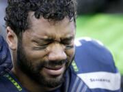 Seattle Seahawks quarterback Russell Wilson cries after winning NFC Championship game against the Green Bay Packers Sunday, Jan. 18, 2015, in Seattle.