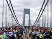 Runners cross the Verrazano-Narrows Bridge at the start of the New York City Marathon, Sunday, Nov.