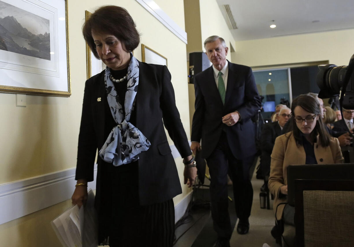 University of North Carolina Chancellor Carol Folt, left, and President Tom Ross prepare to address members of the media with results of an investigation into academic irregularities following a special joint meeting of the University of North Carolina Board of Governors and the UNC-Chapel Hill Board of Trustees in Chapel Hill, N.C., on Wednesday.