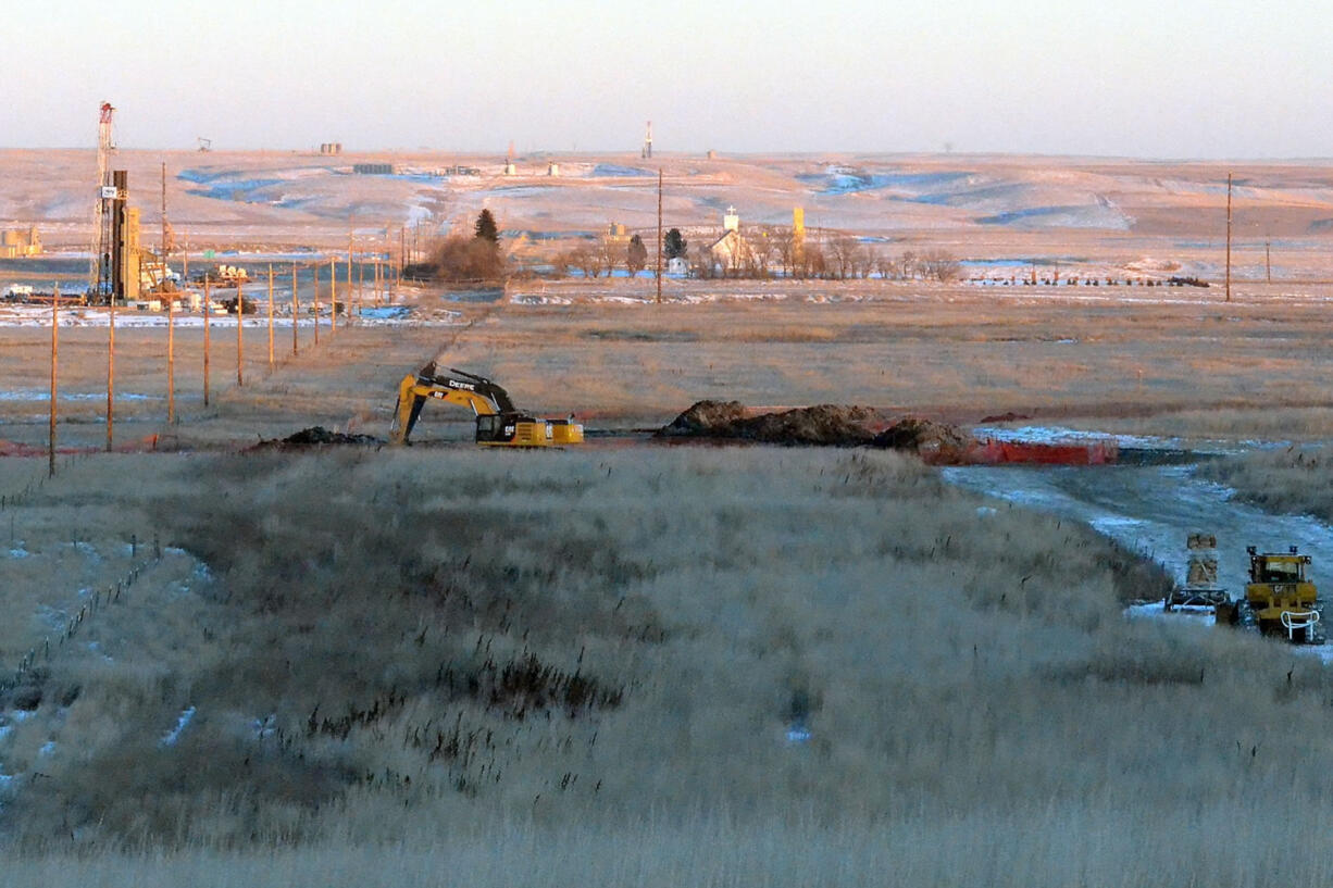 In this photo taken Jan. 12, 2015, crews dig up land at a saltwater spill site near Blacktail Creek outside Williston, N.D. A North Dakota health official called the 70,000 barrel spill the state's largest during the state's current oil boom.