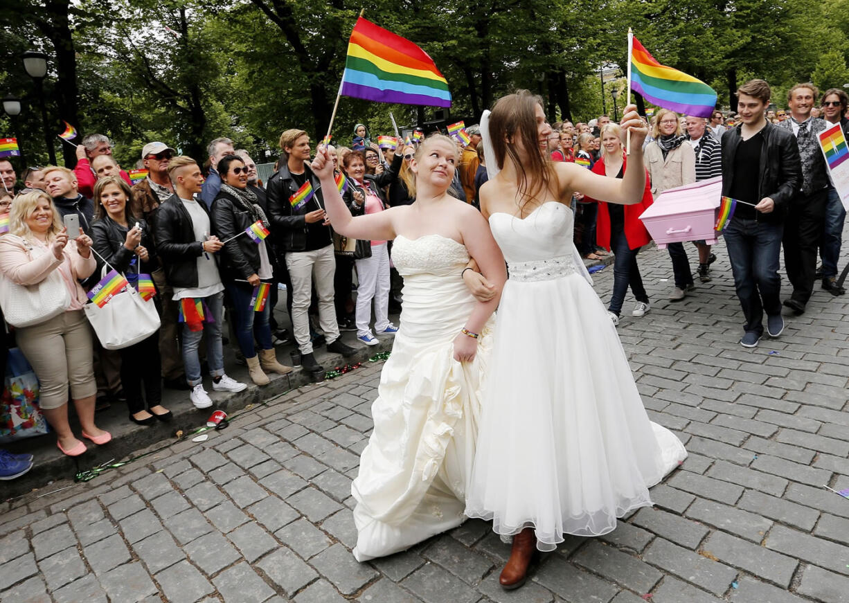 TERJE BENDIKSY/Associated Press
Participants march through downtown Oslo, Norway, during the Euro Pride gay parade Saturday. More than 15,000 people took part in the parade.