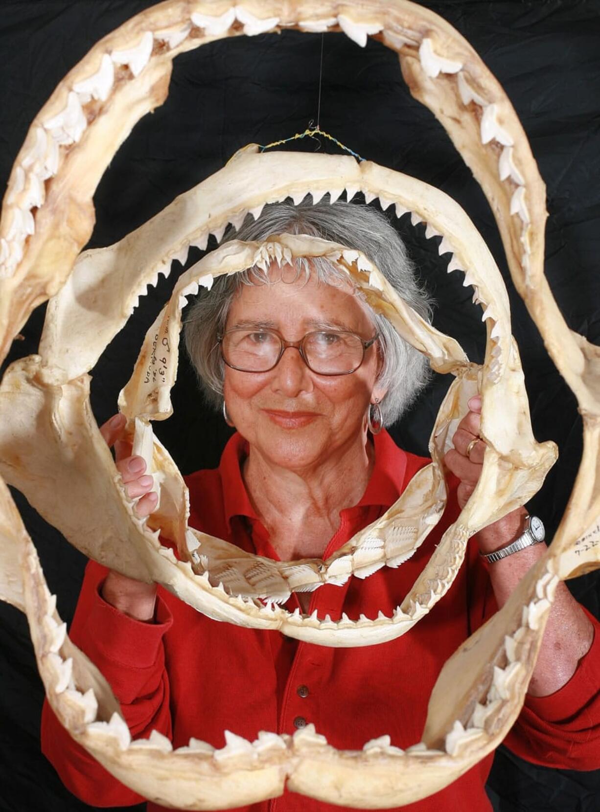 Associated Press files
Shark expert Dr. Eugenie Clark poses with jaws of various sharks in 2006.