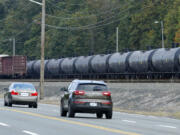 A long line of rail cars containing oil sit on tracks south of Seattle in September.