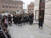 School girls gather outside the visitor's center May 28 at the Touro Synagogue during a tour in Newport, R.I.