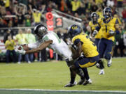 Oregon's Dwayne Stanford, left, scores a touchdown.