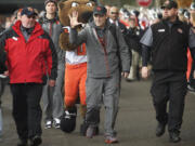 Oregon State football coach Mike Riley waves to fans as the Beavers arrive at Reser Stadium before Saturday's Civil War Game against Oregon.