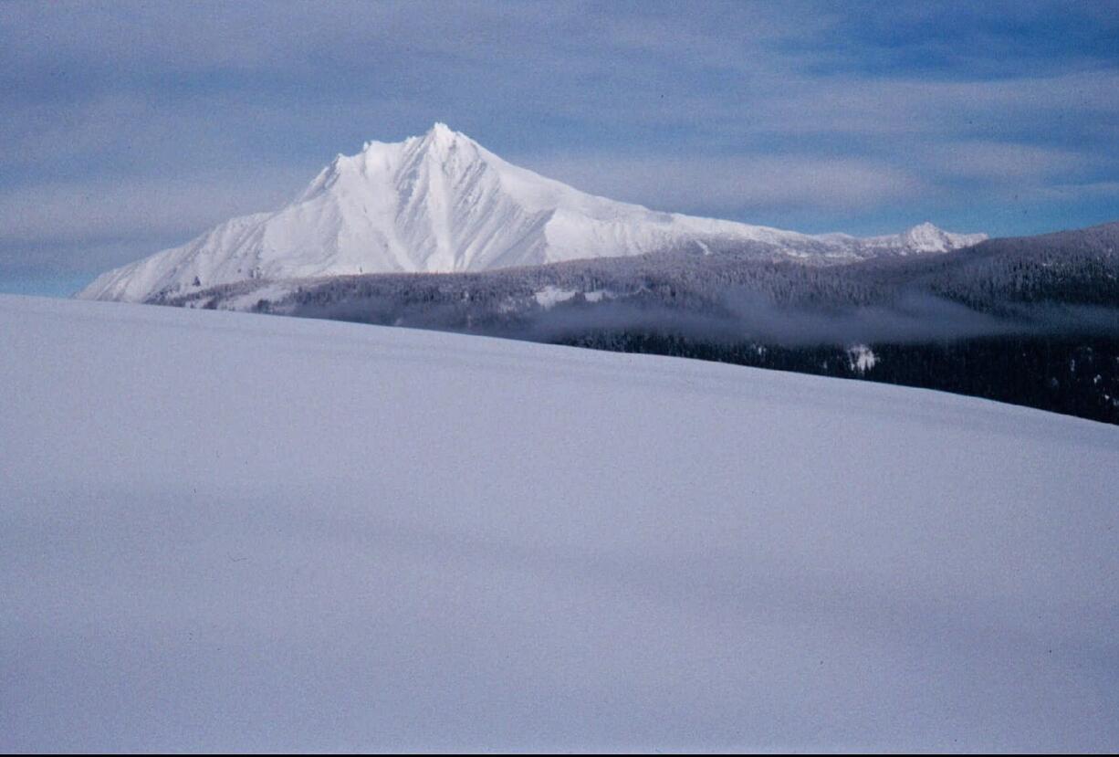 Oregon's mountain snowpack -- such as on Mount Jefferson, seen from Bruno Meadows Road near Sisters, Ore. -- vital for farmers, fish and skiers, is in the midst of another miserable year, posting record low snow depths despite precipitation levels that are generally normal. The reason is persistent warm weather, which is turning into the new normal as the climate heats up.