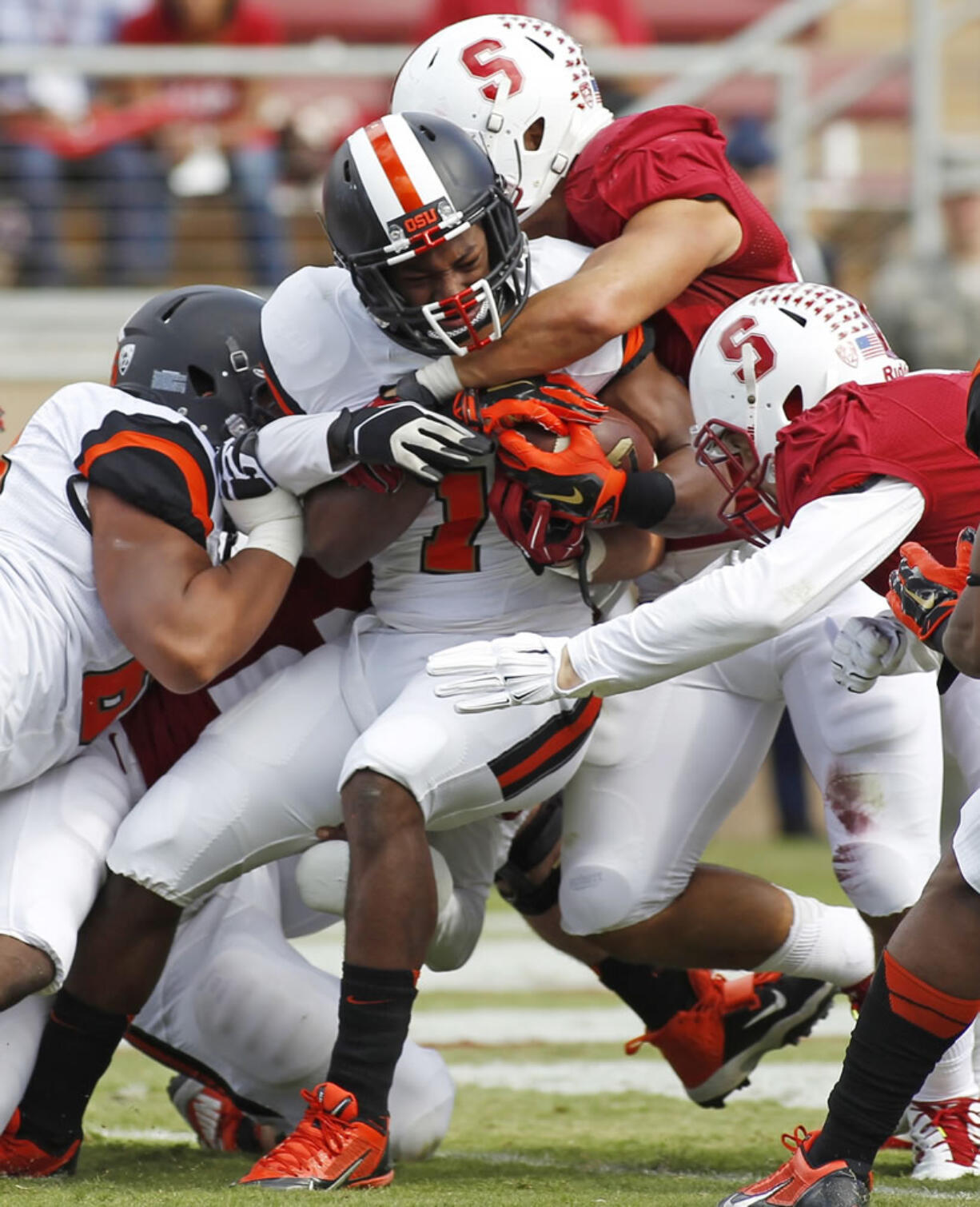 Oregon State's Chris Brown, center, fights his way into the end zone for a touchdown Saturday at Stanford, but little went well for the Beavers.