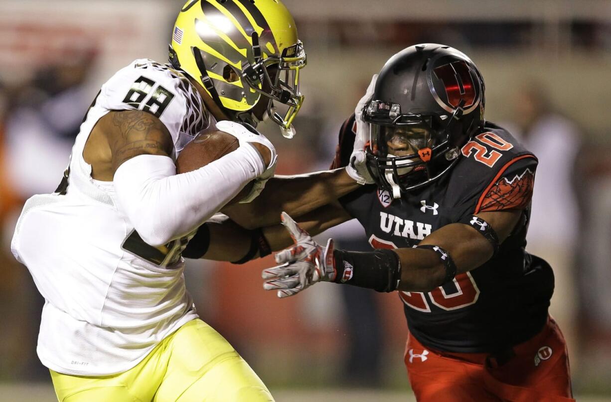 Oregon wide receiver Dwayne Stanford (88) scores a touchdown against Utah defensive back Marcus Williams (20) in the fourth quarter Sunday, Nov. 9, 2014, in Salt Lake City.