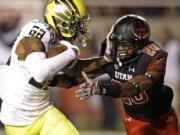 Oregon wide receiver Dwayne Stanford (88) scores a touchdown against Utah defensive back Marcus Williams (20) in the fourth quarter Sunday, Nov. 9, 2014, in Salt Lake City.