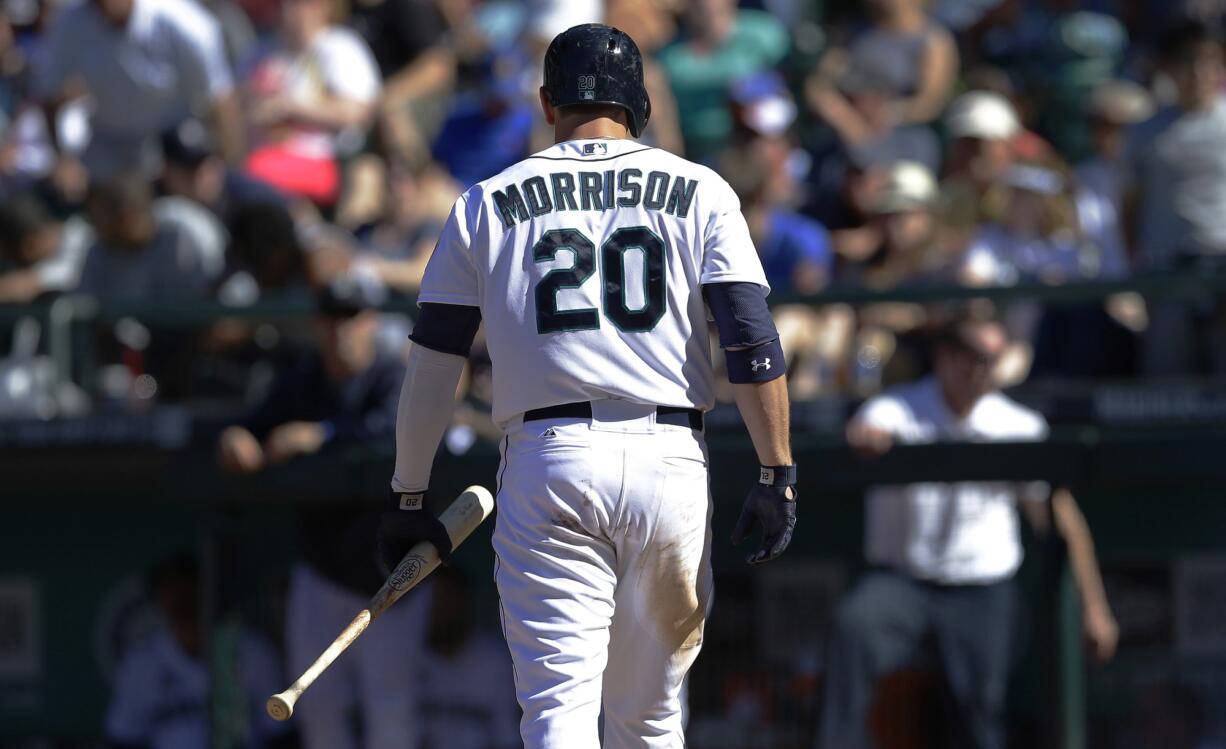 Seattle Mariners' Logan Morrison walks to the dugout after striking out swigging for the third out of the 10th inning Sunday against the Baltimore Orioles. Morrison was 0-4 and the Orioles beat the Mariners 3-2. (AP Photo/Ted S.