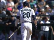 Seattle Mariners' Logan Morrison walks to the dugout after striking out swigging for the third out of the 10th inning Sunday against the Baltimore Orioles. Morrison was 0-4 and the Orioles beat the Mariners 3-2. (AP Photo/Ted S.