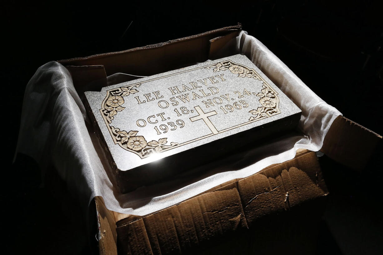 ANDY JACOBSOHN/Dallas Morning News via  AP
The original tombstone of Lee Harvey Oswald is shown Aug. 7 in Poor David's Pub in Dallas. The pub's owner, David Card, 75, has the marker following a settlement.