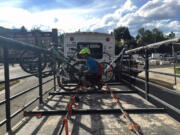 Emmett Purcell loads a mountain bike on the Helena, Mont., Trail Rider Shuttle.