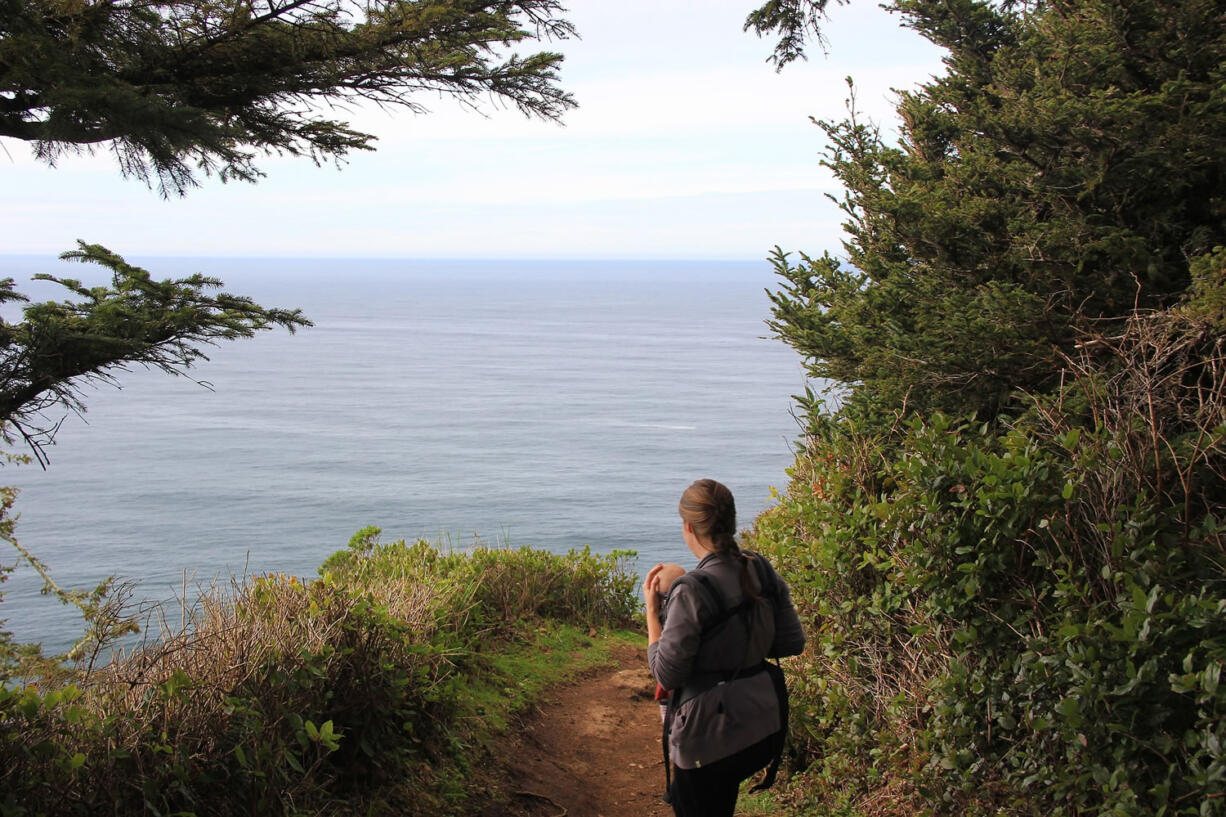 Robyn Orr hikes March 20 with her 5-month-old daughter, Lucy, on the Cape Trail at Cape Lookout State Park on the Oregon Coast, south of Tillamook, Ore.