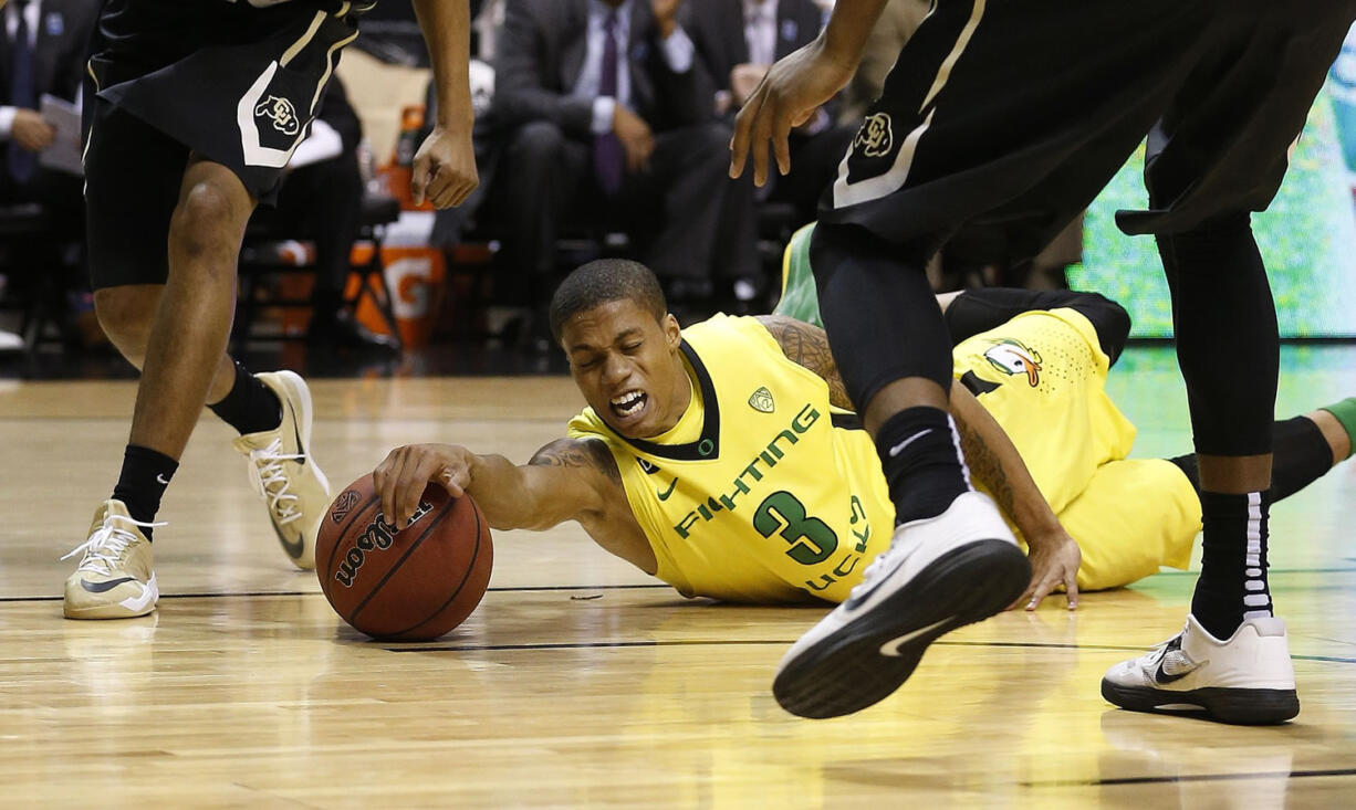 Oregon's Joseph Young dives for the ball against Colorado in the quarterfinals of the Pac-12 conference tournament Thursday in Las Vegas.