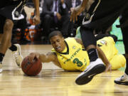 Oregon's Joseph Young dives for the ball against Colorado in the quarterfinals of the Pac-12 conference tournament Thursday in Las Vegas.