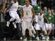 Oregon's Joseph Young celebrates after scoring a 3-point game winning shot against Utah in the final seconds of the semifinals of the Pac-12 conference tournament Friday.