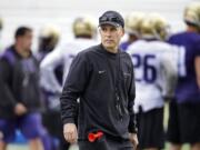 Washington head coach Chris Petersen watches NCAA college football practice drills, Monday, March 30, 2015, on the first day of spring practice in Seattle. (AP Photo/Ted S.