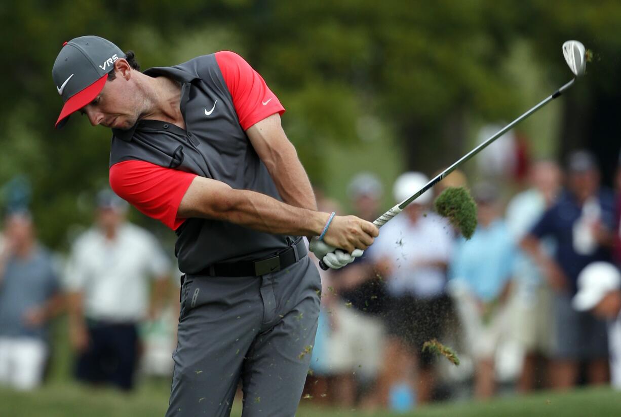 Rory McIlroy, of Northern Ireland, hits from the fairway on the 18th hole during the first round of the PGA Championship golf tournament at Valhalla Golf Club on Thursday, Aug. 7, 2014, in Louisville, Ky.