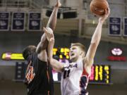 Gonzaga's Domantas Sabonis (11) shoots against Pacific's Eric Thompson (12) during the second half in Spokane on Saturday, Jan. 24, 2015. Gonzaga won 91-60.